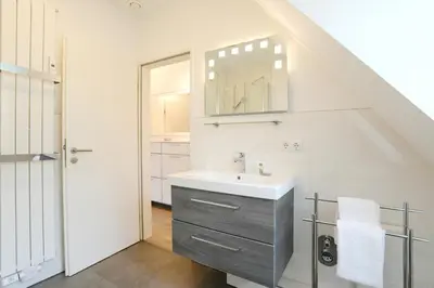 Ein Badezimmer in der Unterkunft Am Rosenhain 14 Appartement 4