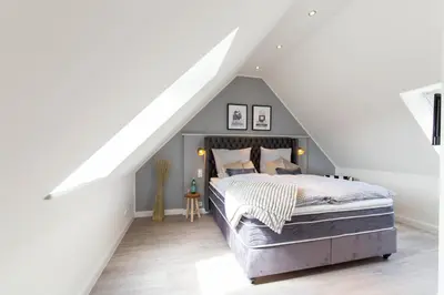 Ein Bett oder Betten in einem Zimmer der Unterkunft Ferienhaus Haff-Living Haffkrug