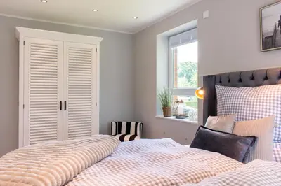 Ein Bett oder Betten in einem Zimmer der Unterkunft Ferienhaus Haff-Living Haffkrug