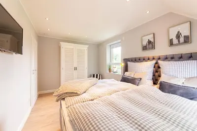Ein Bett oder Betten in einem Zimmer der Unterkunft Ferienhaus Haff-Living Haffkrug