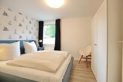 Ein Bett oder Betten in einem Zimmer der Unterkunft Lindenallee 4 Appartement Meerverliebt