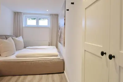 Ein Bett oder Betten in einem Zimmer der Unterkunft Lindenallee 4 Appartement Meerverliebt