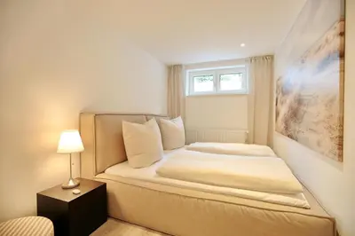 Ein Bett oder Betten in einem Zimmer der Unterkunft Lindenallee 4 Appartement Meerverliebt