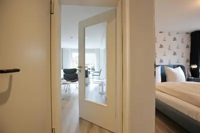 Ein Bett oder Betten in einem Zimmer der Unterkunft Lindenallee 4 Appartement Meerverliebt