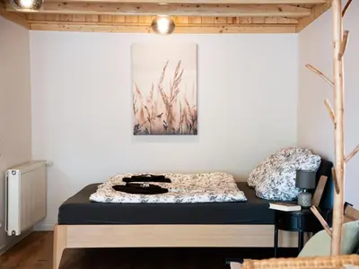 Ein Bett oder Betten in einem Zimmer der Unterkunft Birdhouse