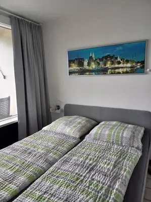 Ein Bett oder Betten in einem Zimmer der Unterkunft Ferienwohnung mit Ostseeblick & Strandlage
