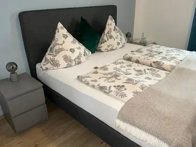 Ein Bett oder Betten in einem Zimmer der Unterkunft Baltic Stuben Hotel Garni Travemünde