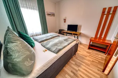 Ein Bett oder Betten in einem Zimmer der Unterkunft Baltic Stuben Hotel Garni Travemünde