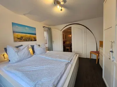 Ein Bett oder Betten in einem Zimmer der Unterkunft Ferienwohnung Raphael Timmendorfer Strand Gorch-Fock-Straße