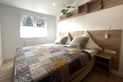 Ein Bett oder Betten in einem Zimmer der Unterkunft Ostseecamp Ferienhaus 