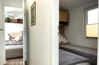 Ein Bett oder Betten in einem Zimmer der Unterkunft Ostseecamp Ferienhaus 
