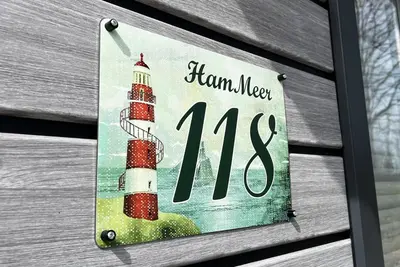 Ein Zertifikat, Auszeichnung, Logo oder anderes Dokument, das in der Unterkunft Ostseecamp Ferienhaus 