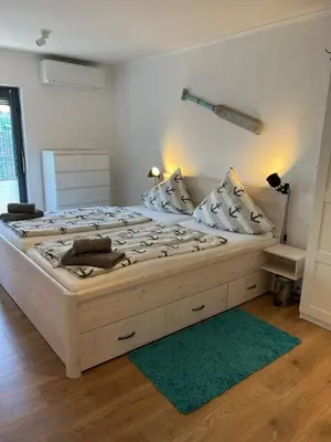 Ein Bett oder Betten in einem Zimmer der Unterkunft Ferienbungalow Wolburg II