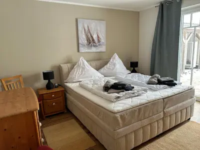 Ein Bett oder Betten in einem Zimmer der Unterkunft Seewind EG
