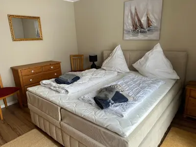 Ein Bett oder Betten in einem Zimmer der Unterkunft Seewind EG
