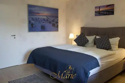Ein Bett oder Betten in einem Zimmer der Unterkunft Gästehaus Marie