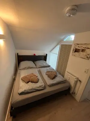 Ein Bett oder Betten in einem Zimmer der Unterkunft Meeresrauschen - Strandnah und ruhig
