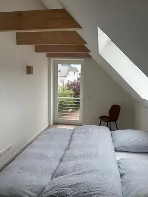 Ein Bett oder Betten in einem Zimmer der Unterkunft Timmendorfer Herz
