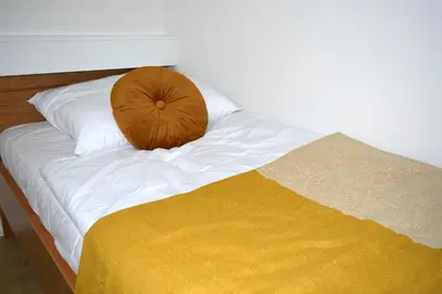 Ein Bett oder Betten in einem Zimmer der Unterkunft NA - Ostsee-Traum - Ferienwohnung mit Meerblick am Hansa Park, W-LAN & Parkplatz kostenlos