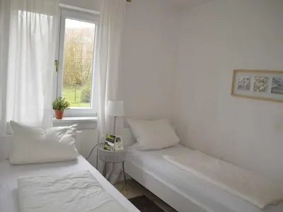Ein Bett oder Betten in einem Zimmer der Unterkunft Strandrausch Comfortable holiday residence