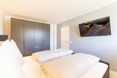 Ein Bett oder Betten in einem Zimmer der Unterkunft Ferienwohnung Pier 51 Scharbeutz