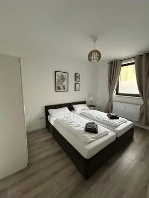 Ein Bett oder Betten in einem Zimmer der Unterkunft Central Cozy 2 Apartment Lübeck