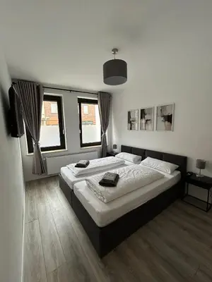 Ein Bett oder Betten in einem Zimmer der Unterkunft Central Cozy 2 Apartment Lübeck