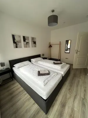 Ein Bett oder Betten in einem Zimmer der Unterkunft Central Cozy 2 Apartment Lübeck