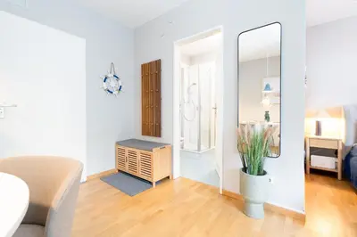 Ein Bett oder Betten in einem Zimmer der Unterkunft Strandgänger App 110