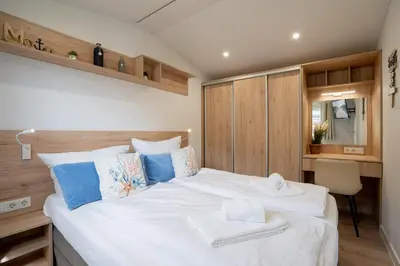 Ein Bett oder Betten in einem Zimmer der Unterkunft Ostseecamp Ferienhaus 