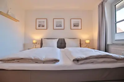 Ein Bett oder Betten in einem Zimmer der Unterkunft Haus Ostseeallee 33 Appartement 8 Strandhafer