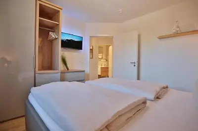 Ein Bett oder Betten in einem Zimmer der Unterkunft Haus Ostseeallee 33 Appartement 8 Strandhafer