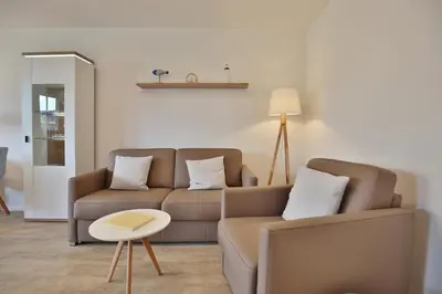 Ein Sitzbereich in der Unterkunft Haus Ostseeallee 33 Appartement 8 Strandhafer