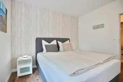 Ein Bett oder Betten in einem Zimmer der Unterkunft BeachLife Appartement 10