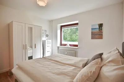 Ein Bett oder Betten in einem Zimmer der Unterkunft BeachLife Appartement 10