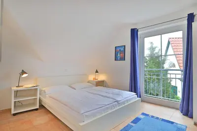 Ein Bett oder Betten in einem Zimmer der Unterkunft Küstenblick