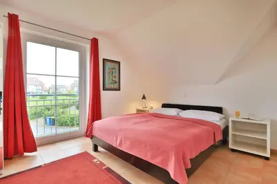 Ein Bett oder Betten in einem Zimmer der Unterkunft Küstenblick