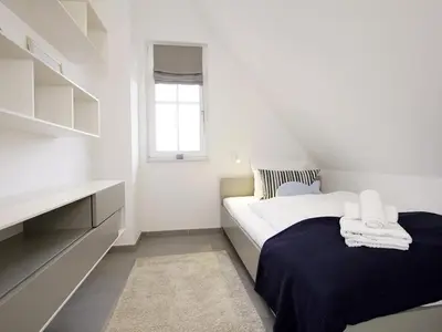 Ein Bett oder Betten in einem Zimmer der Unterkunft Kranich Ferienhaus
