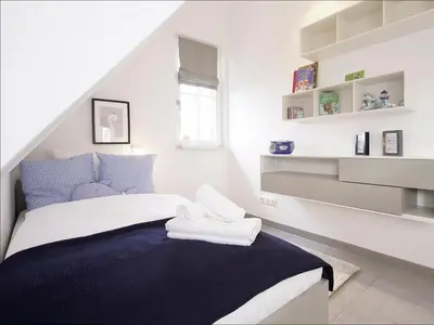Ein Bett oder Betten in einem Zimmer der Unterkunft Kranich Ferienhaus