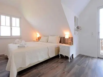 Ein Bett oder Betten in einem Zimmer der Unterkunft Nausikaa's- Fleur de Lis