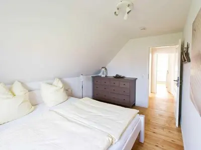 Ein Bett oder Betten in einem Zimmer der Unterkunft Ruhe-Insel Ferienhaus