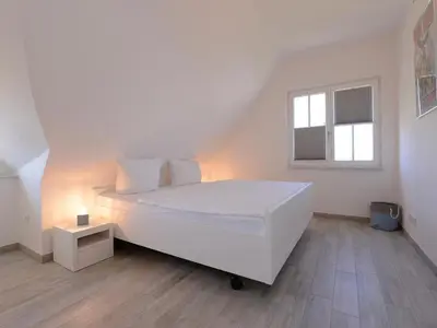 Ein Bett oder Betten in einem Zimmer der Unterkunft Strandbank
