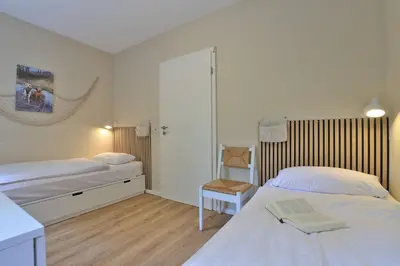 Ein Bett oder Betten in einem Zimmer der Unterkunft Whg Wismar, Groß Schwansee