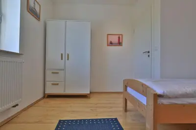 Ein Bett oder Betten in einem Zimmer der Unterkunft Wellenreiter Ferienhaus