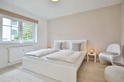 Ein Bett oder Betten in einem Zimmer der Unterkunft Ferienanlage Poststraße 41 Appartement 3 Emil