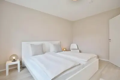 Ein Bett oder Betten in einem Zimmer der Unterkunft Ferienanlage Poststraße 41 Appartement 3 Emil