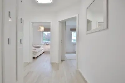 Ein Bett oder Betten in einem Zimmer der Unterkunft Ferienanlage Poststraße 41 Appartement 3 Emil