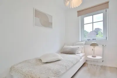Ein Bett oder Betten in einem Zimmer der Unterkunft Ferienanlage Poststraße 41 Appartement 3 Emil