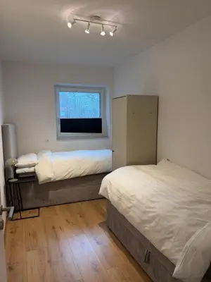 Ein Bett oder Betten in einem Zimmer der Unterkunft Hansehaus Lübeck - Altstadtblick