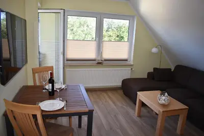 Ein Sitzbereich in der Unterkunft Haus zum Strand Muschel